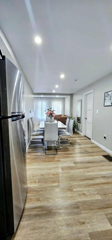 495 Chicago Street Fall River, MA 02721 - Photo 10 of 23 a room with lots of chairs and mirrors