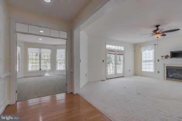 a view of a hallway to a bedroom and stairs