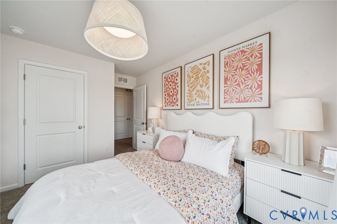 3548 Perrins Hill Way Prince George, VA 23875 - Photo 13 of 17 a bedroom with a bed and a lamp on table