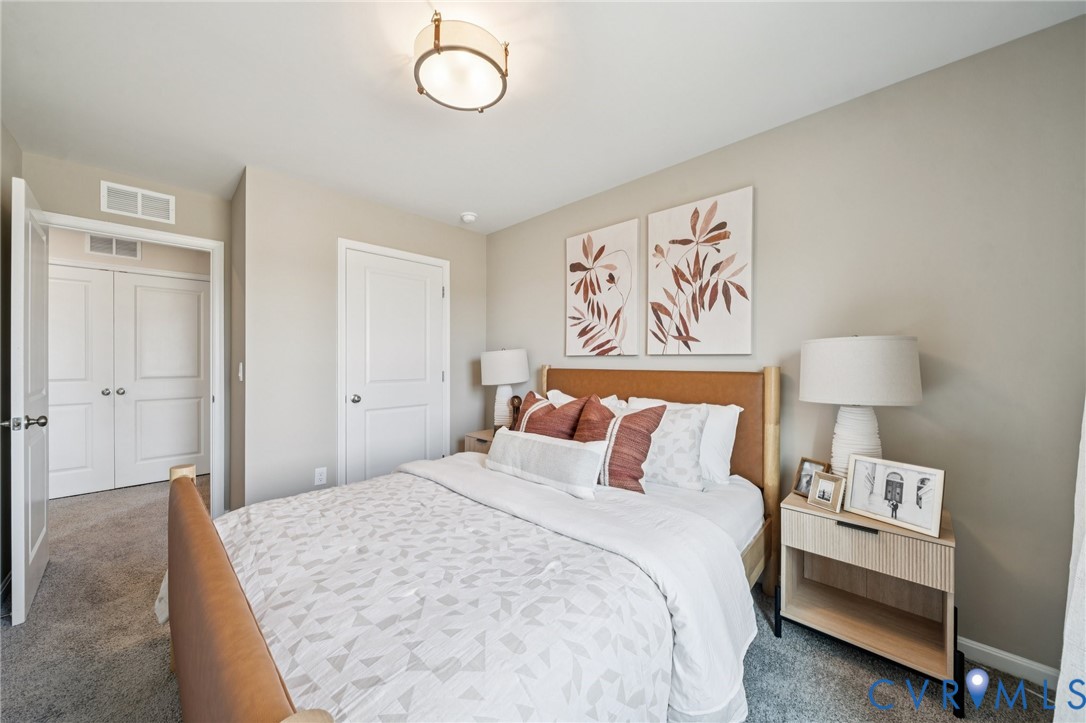 3548 Perrins Hill Way Prince George, VA 23875 - Photo 15 of 17 a bedroom with a bed and a lamp