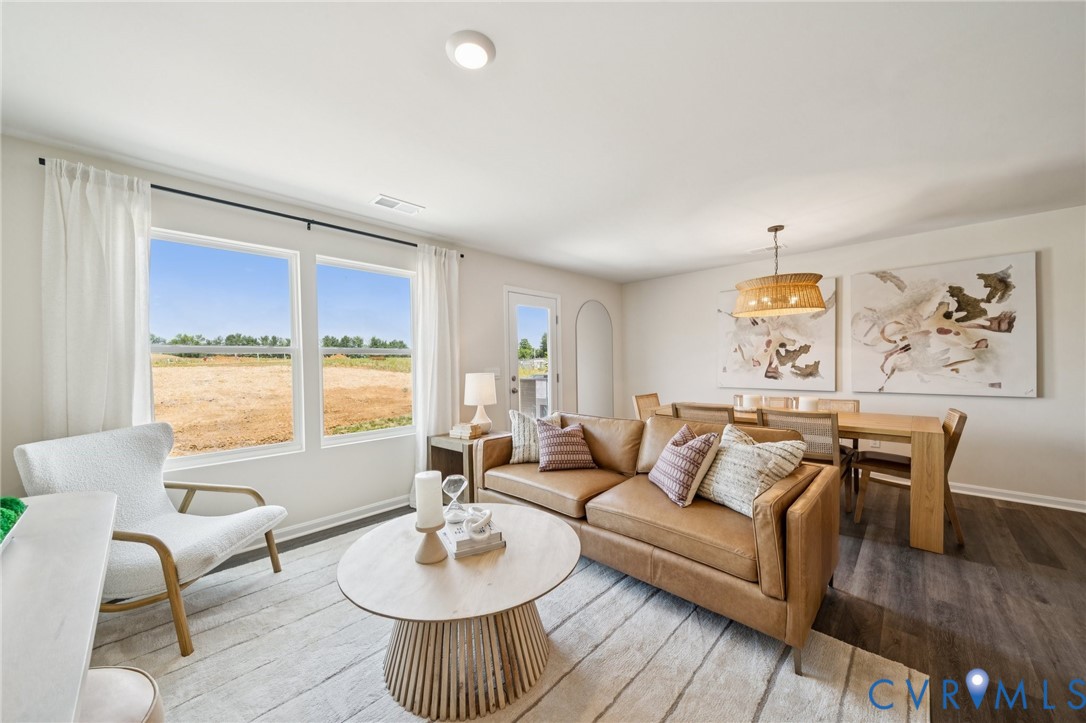 3548 Perrins Hill Way Prince George, VA 23875 - Photo 5 of 17 a living room with furniture and a large window