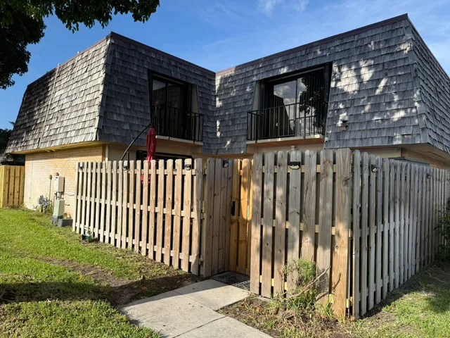 a view of a house with a small yard