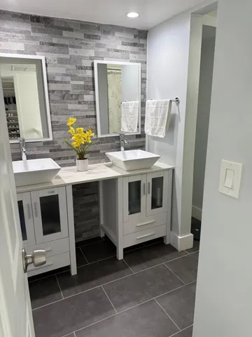 a view of a kitchen with a sink and stove in it