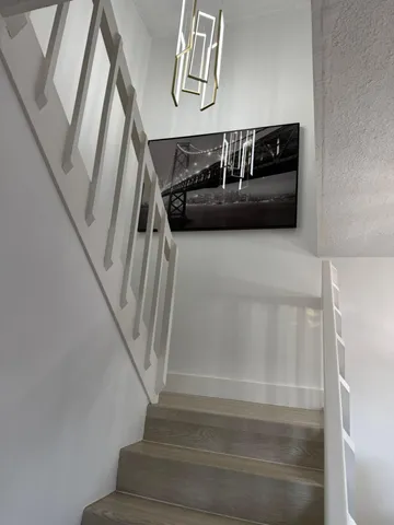 a view of staircase with white walls