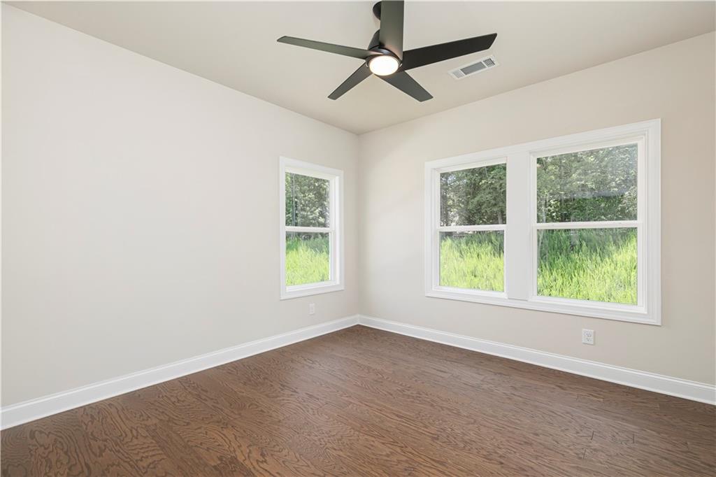 2475 Stewart Road Cumming, GA 30041 - Photo 27 of 30 an empty room with a window and ceiling fan