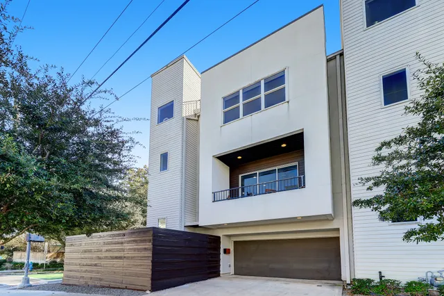 a front view of a house with a garage