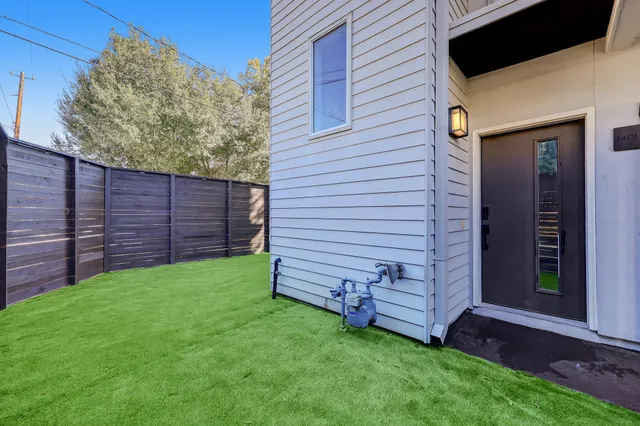 a view of a backyard with a large tree