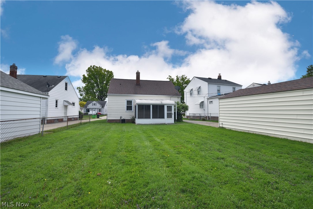 31921 Pendley Road Willowick, OH 44095 - Photo 21 of 22 Back of property with an enclosed porch and lawn