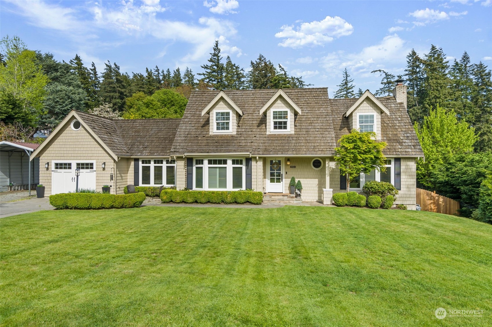 409 Fieldston Road Bellingham, WA 98225 - Photo 1 of 1 a front view of house with yard and green space