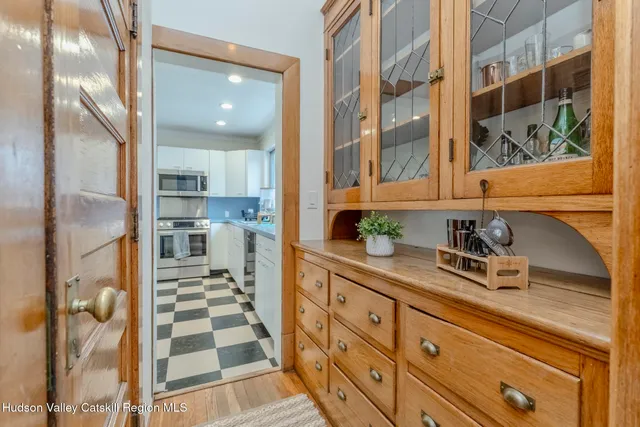 a kitchen with a refrigerator and a sink