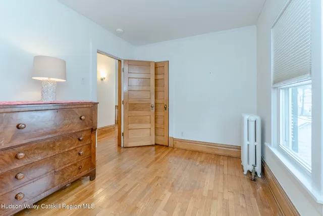 a bedroom with a bed and a table