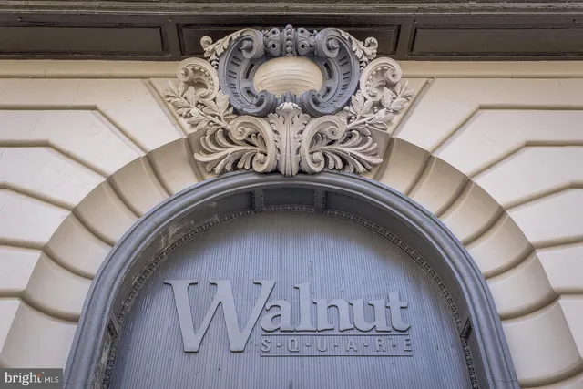 a tall building sitting next to a road