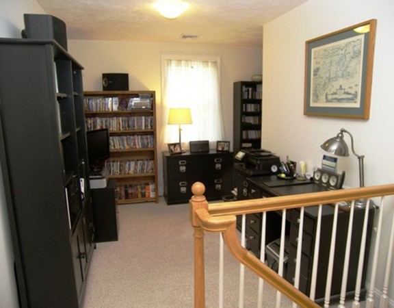 304 Flagg Hill Road Boxborough, MA 01719 - Photo 14 of 20 a room with furniture and book shelf