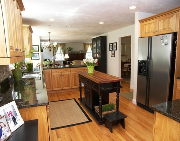 304 Flagg Hill Road Boxborough, MA 01719 - Photo 5 of 20 a kitchen with stainless steel appliances granite countertop a refrigerator a stove and a sink