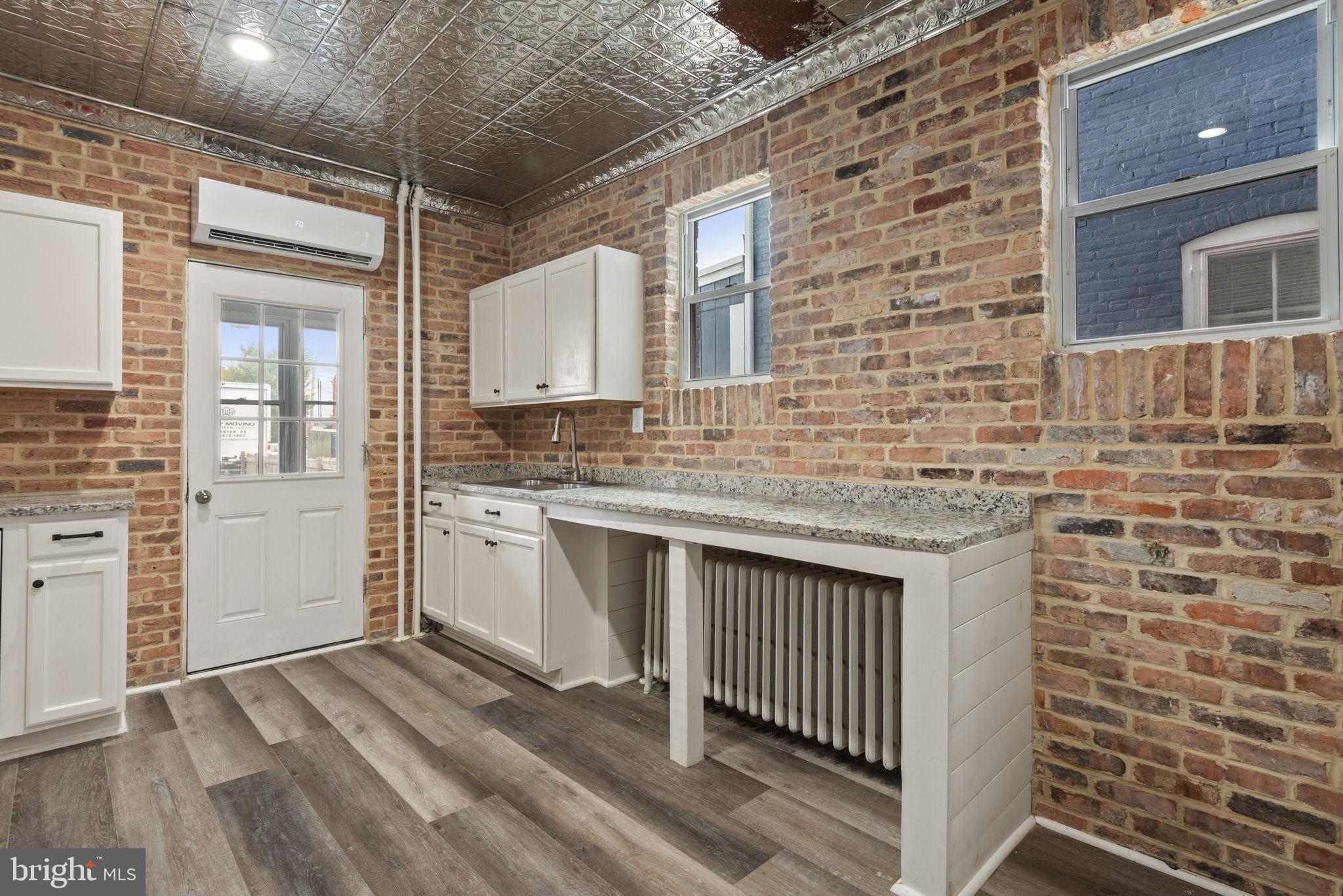 245 Jackson Street Lancaster, PA 17603 - Photo 11 of 38 a kitchen with a sink stove and cabinets