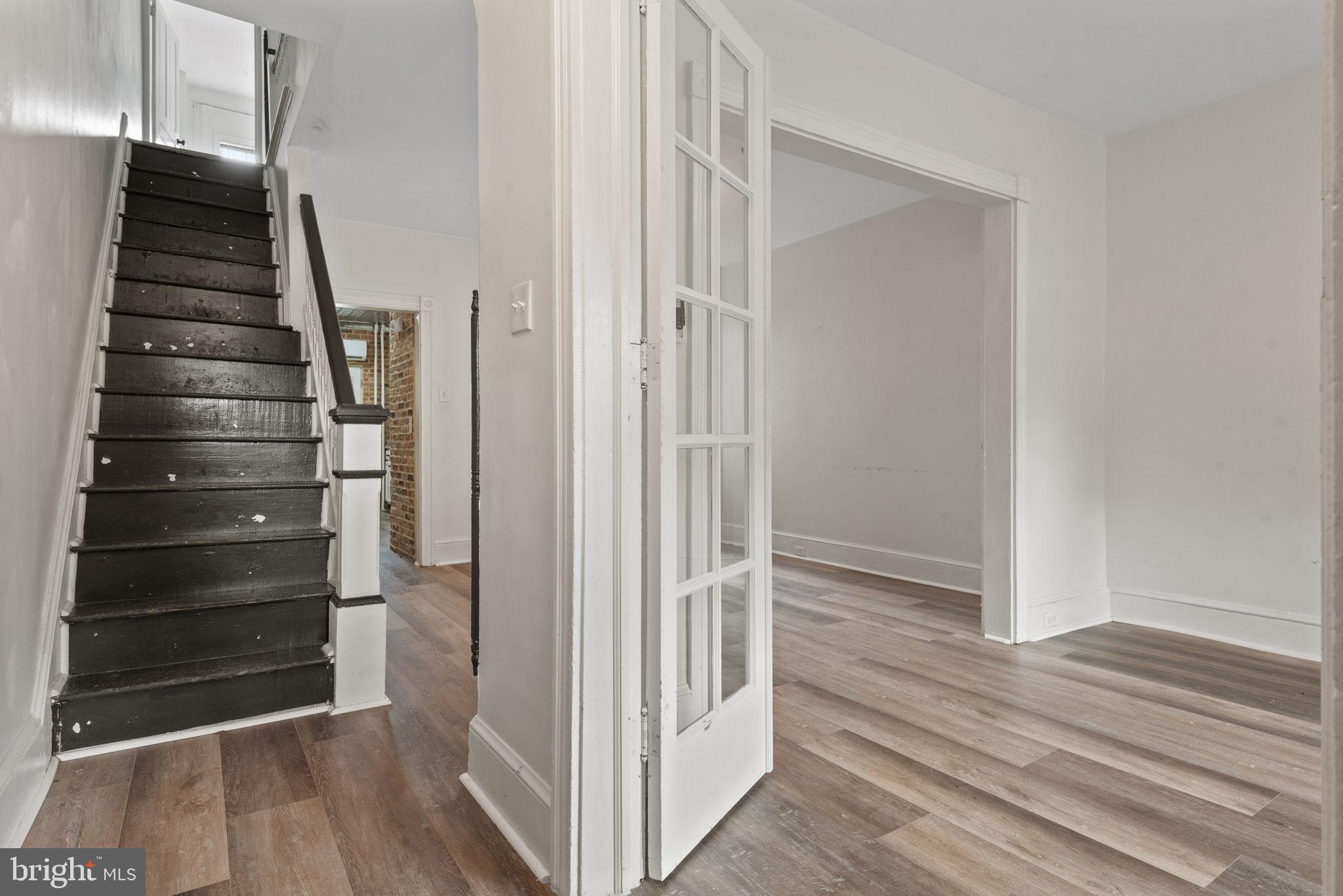 245 Jackson Street Lancaster, PA 17603 - Photo 6 of 38 a view of hallway with stairs and wooden floor
