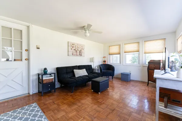 a living room with furniture and a window