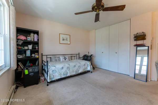 a bed room with a bed and a book shelf