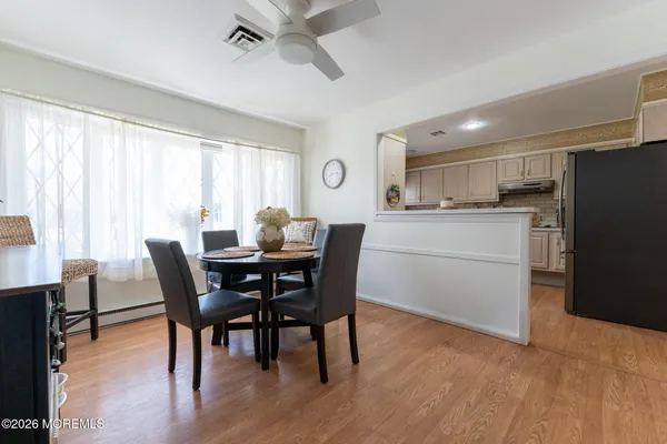 a dining room with furniture and window