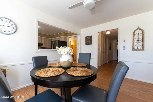 a view of a dining room with furniture and wooden floor