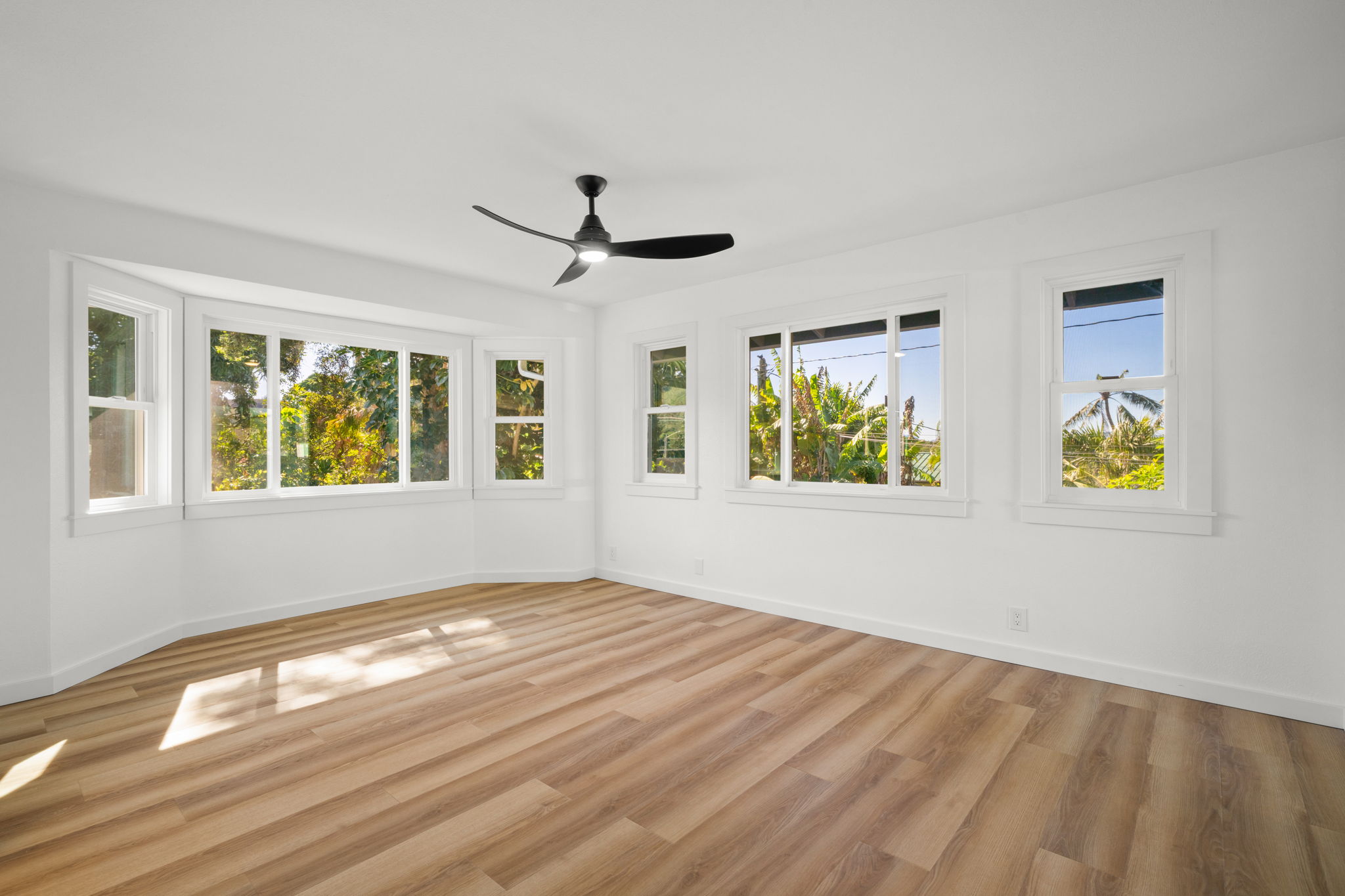 5611 Ohelo Road Kapaa, HI 96746 - Photo 14 of 30 a view of an empty room with window and wooden floor