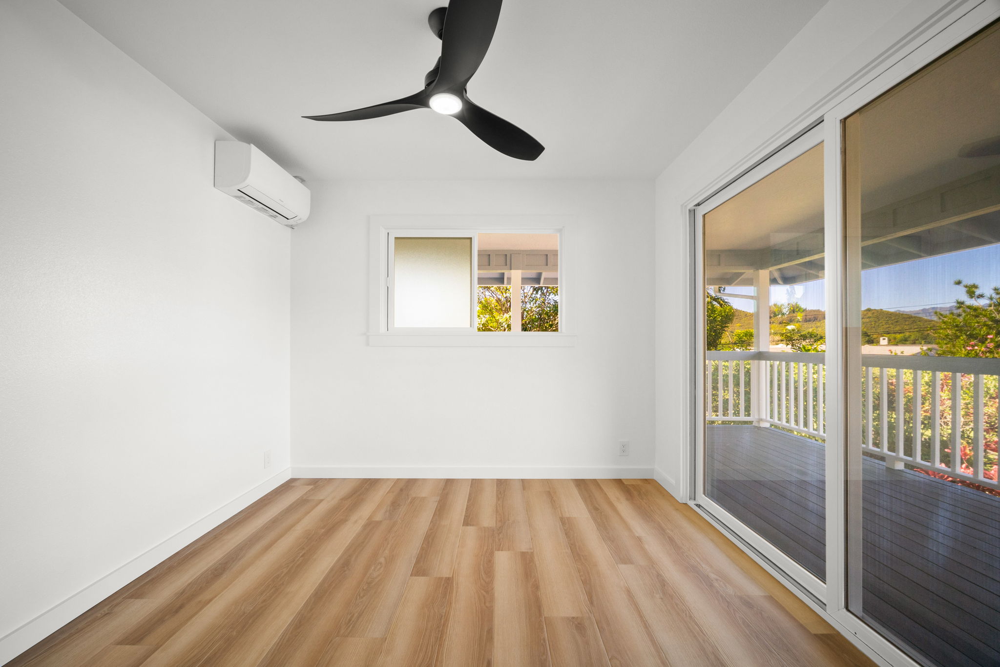 5611 Ohelo Road Kapaa, HI 96746 - Photo 19 of 30 wooden floor in an empty room with a window