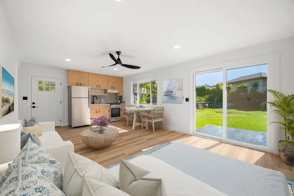 a living room with furniture and a large window