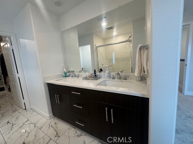 2315 Powell Drive Rialto, CA 92377 - Photo 11 of 27 a bathroom with a sink and a mirror