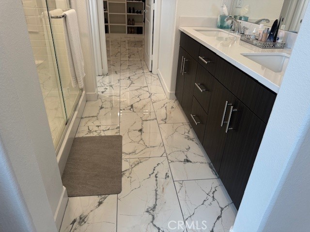 2315 Powell Drive Rialto, CA 92377 - Photo 12 of 27 a bathroom with a sink and mirror