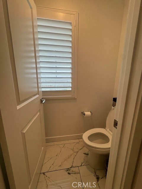 2315 Powell Drive Rialto, CA 92377 - Photo 15 of 27 a bathroom with a toilet and a sink