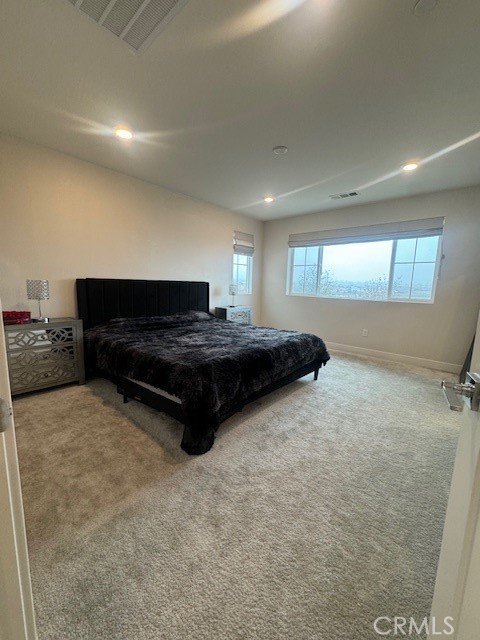 2315 Powell Drive Rialto, CA 92377 - Photo 17 of 27 a living room with a bed furniture and a dresser