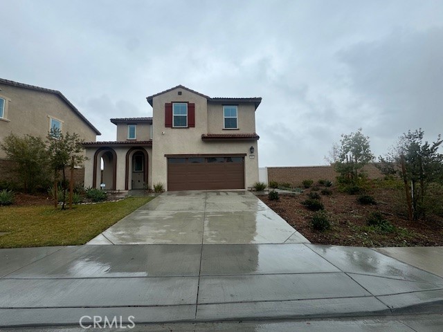 2315 Powell Drive Rialto, CA 92377 - Photo 23 of 27 a front view of a house with garden