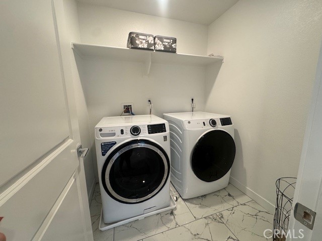 2315 Powell Drive Rialto, CA 92377 - Photo 7 of 27 a utility room with dryer and washer