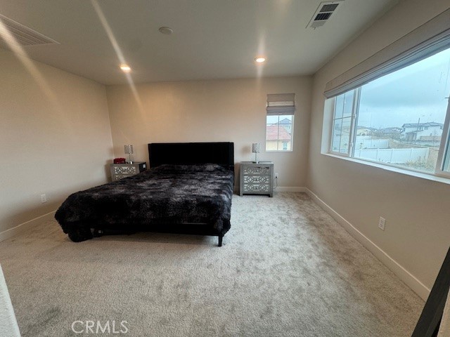 2315 Powell Drive Rialto, CA 92377 - Photo 9 of 27 a bedroom with a bed window and wall painting