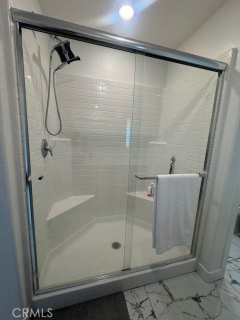 2315 Powell Drive Rialto, CA 92377 - Photo 10 of 27 a bathroom with a glass shower door