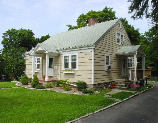 16 Roberts Lane Ridgefield, CT 06877 - Photo 1 of 1 a front view of house with yard and green space