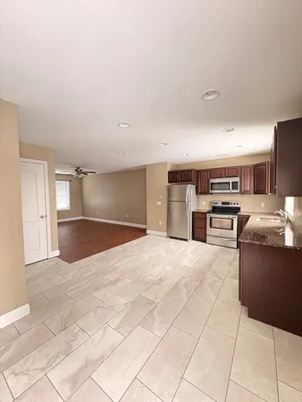 a view of kitchen with furniture and window