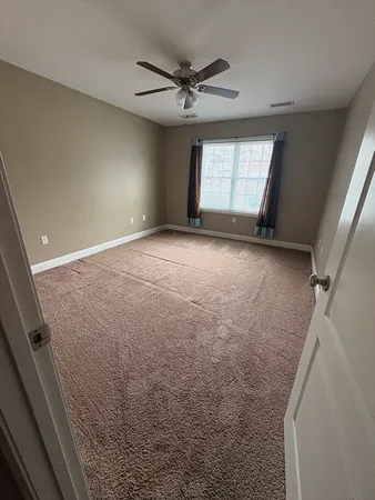 a view of an empty room and a windows