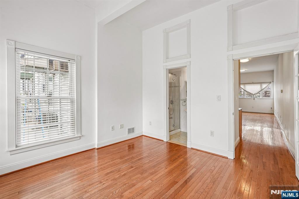 90 A Hackensack Plank Road Weehawken, NJ 07086 - Photo 12 of 40 wooden floor in an empty room with a window
