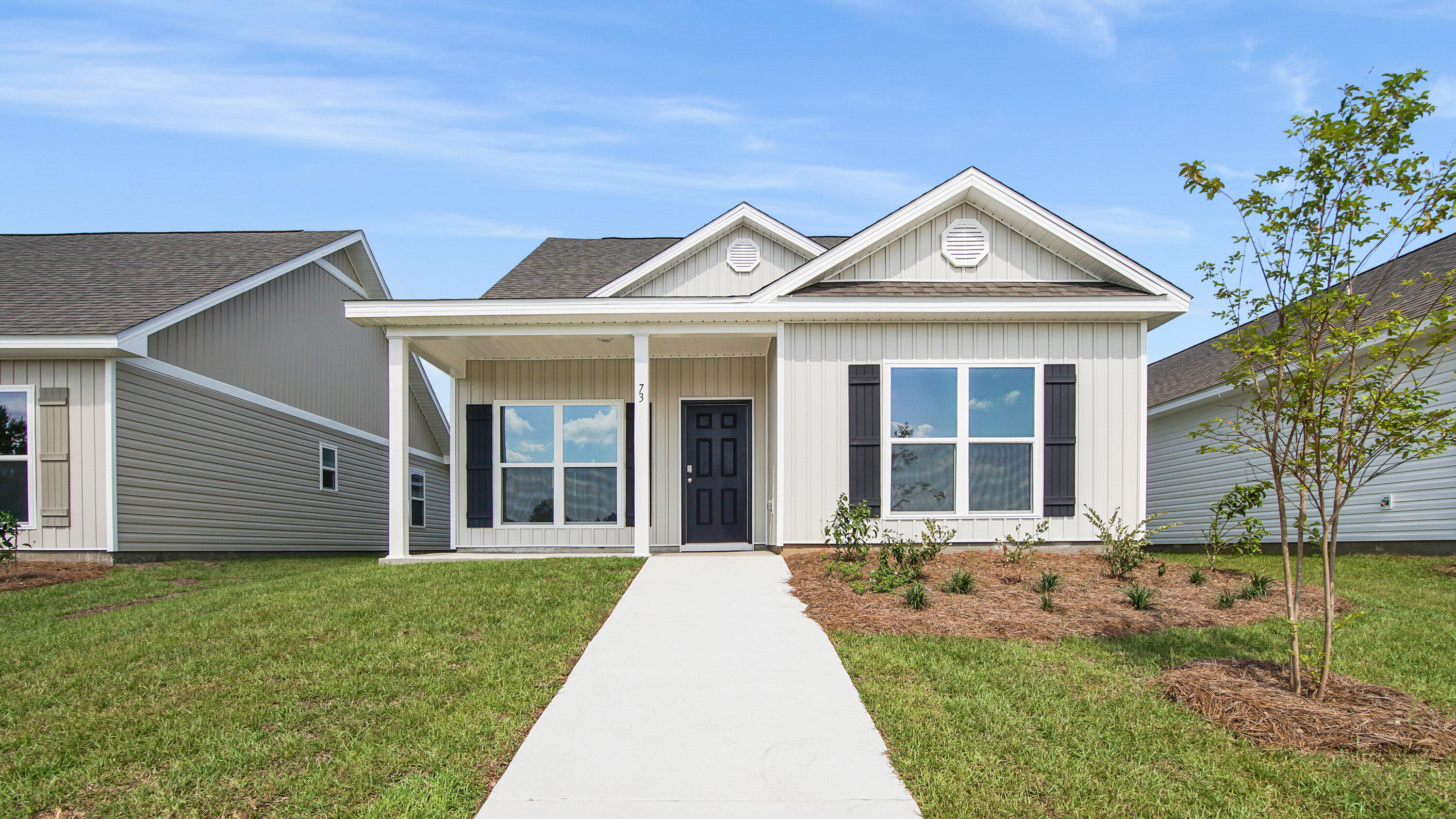 front view of a house with a yard