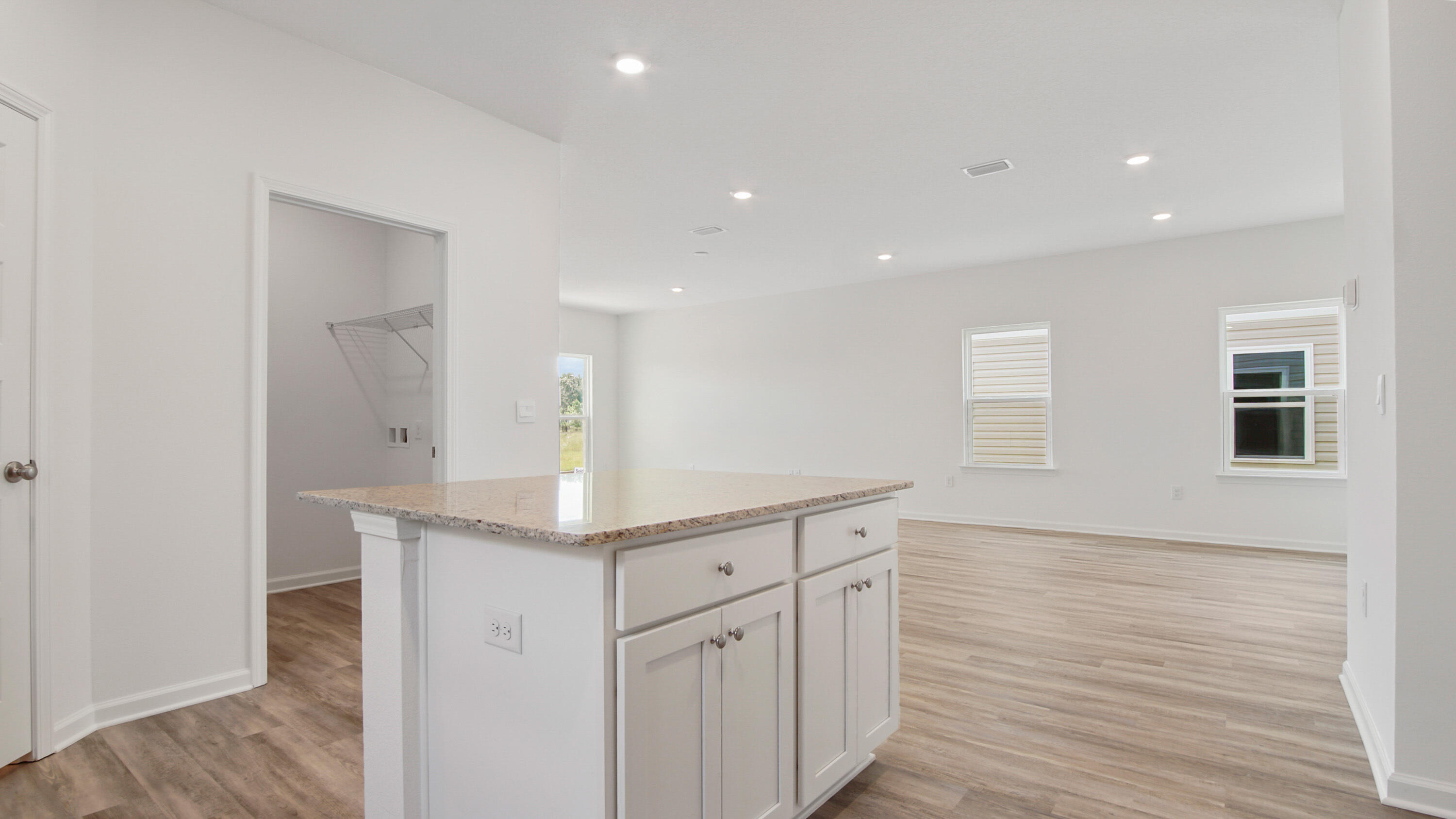73 Huckleberry Street Freeport, FL 32439 - Photo 14 of 34 a spacious bathroom with a granite countertop sink and a mirror