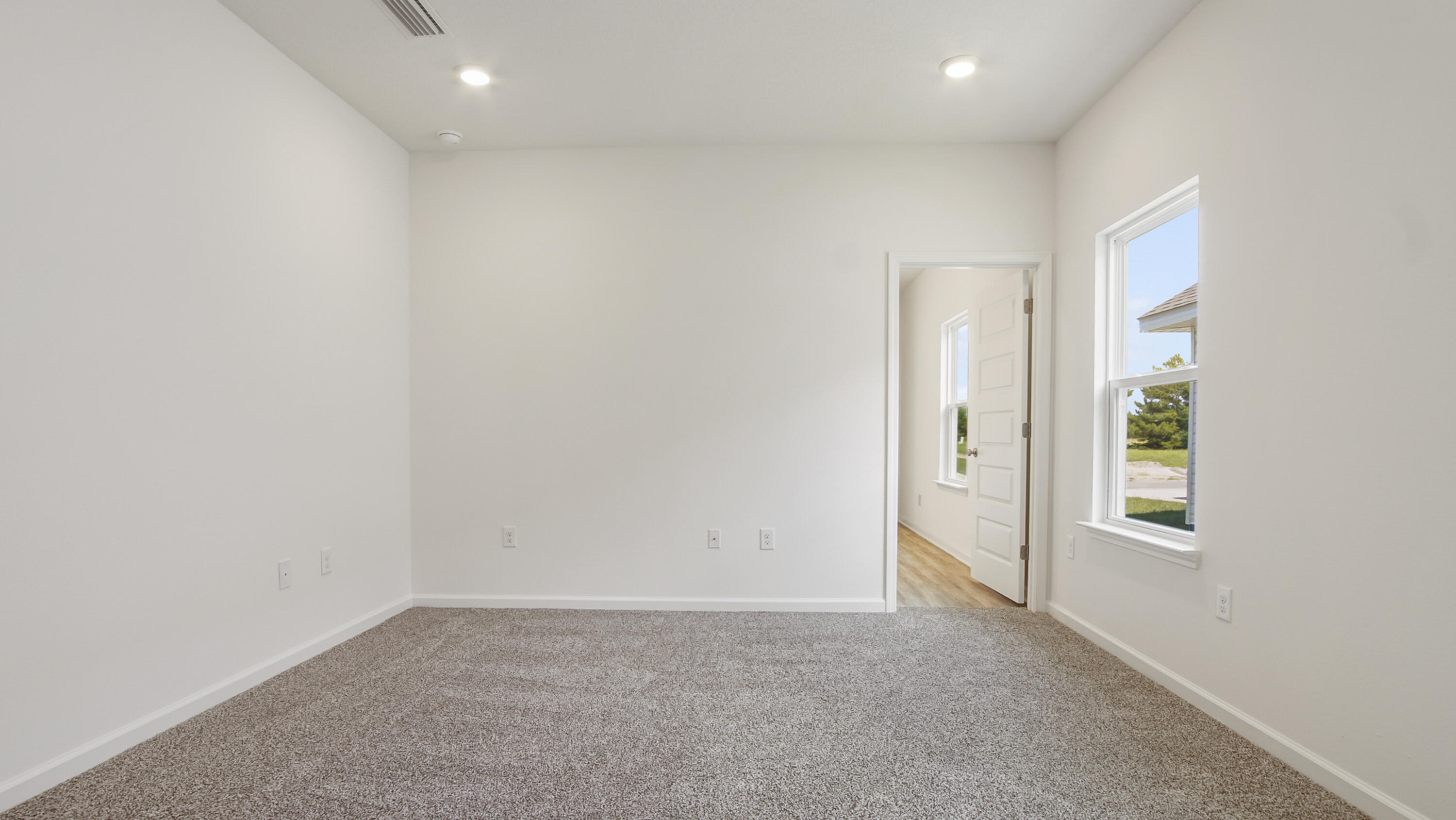 73 Huckleberry Street Freeport, FL 32439 - Photo 17 of 34 an empty room with windows and closet