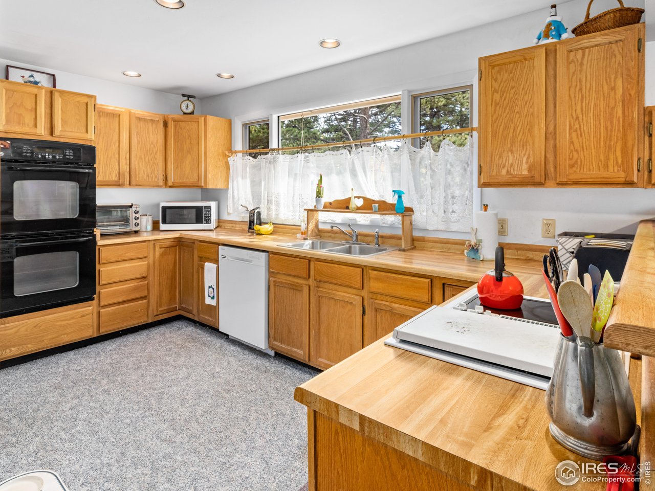 831 Larkspur Road Estes Park, CO 80517 - Photo 13 of 32 The kitchen is large featuring double ovens and great counter space.