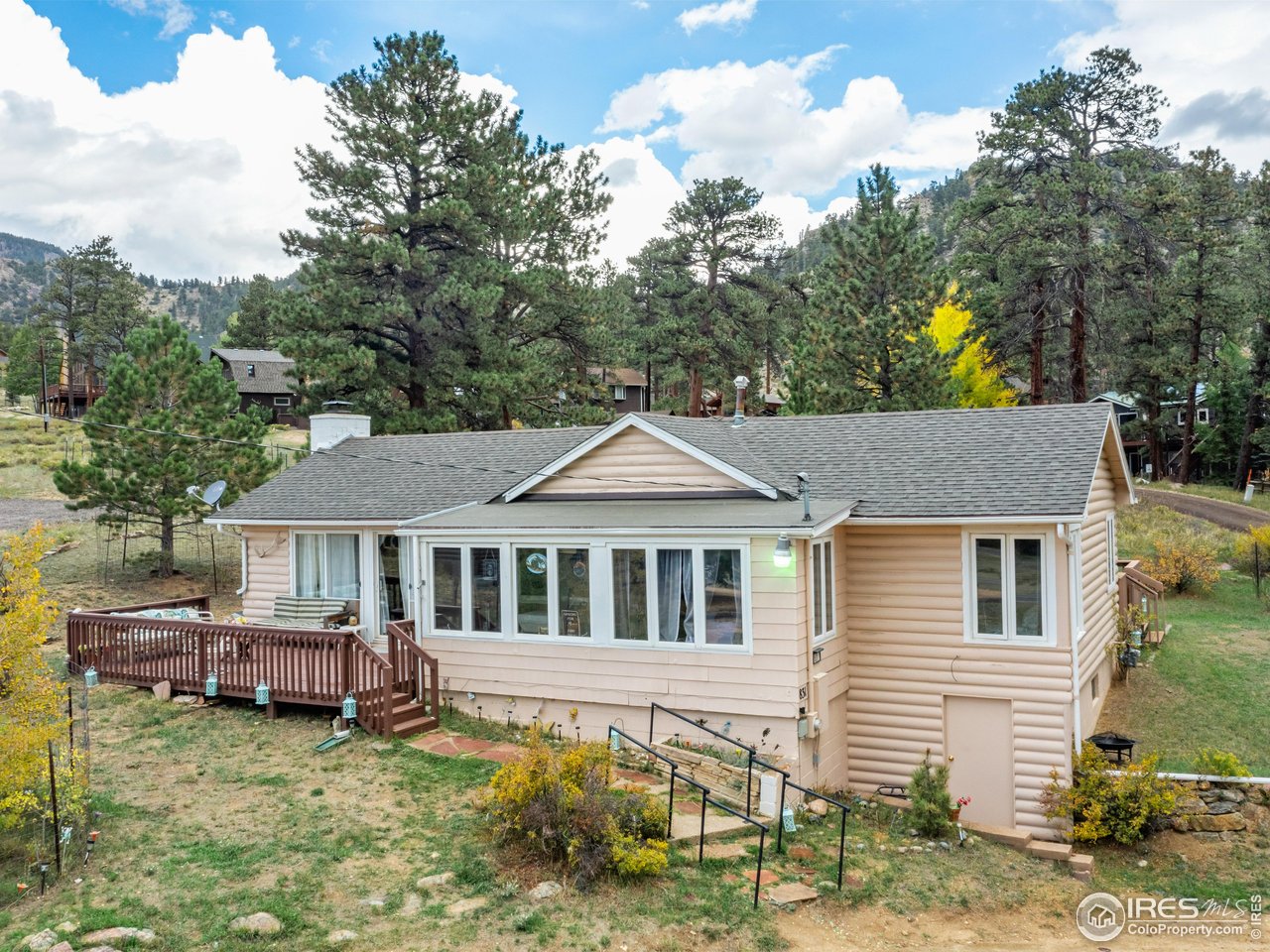 831 Larkspur Road Estes Park, CO 80517 - Photo 2 of 32 Situated on almost a half-acre, this home has room for expansion and a garage.