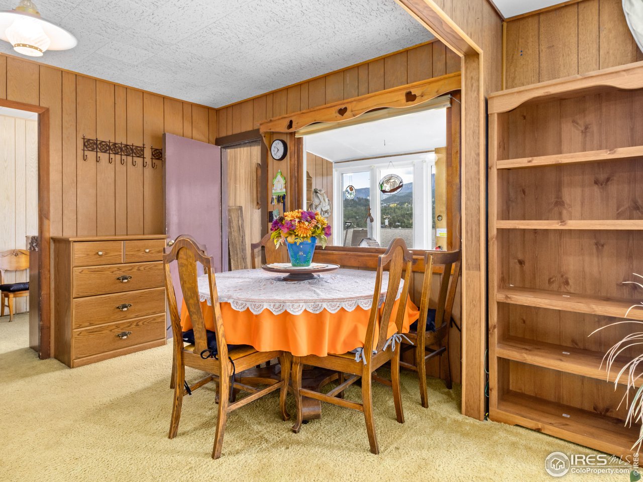 831 Larkspur Road Estes Park, CO 80517 - Photo 9 of 32 Seller will leave this beautiful antique dining table if new owner would like it.