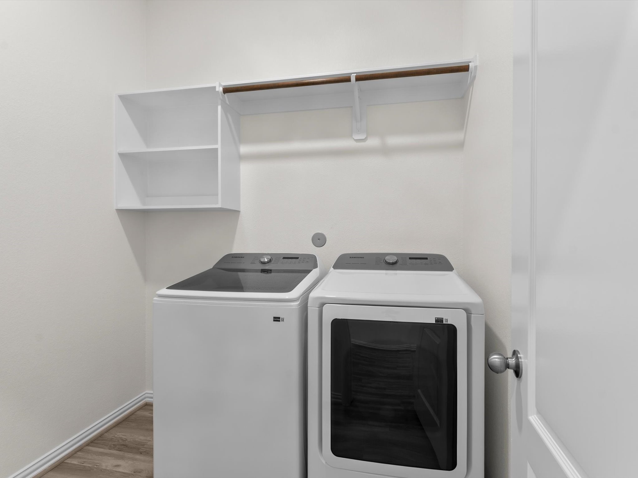 4746 Misty Ranch Drive Spring, TX 77386 - Photo 42 of 49 Clean, functional utility room with convenient space for everyday laundry needs.