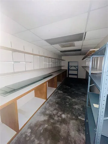 a view of entryway and kitchen