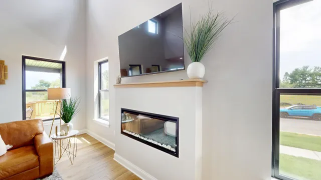 a living room with furniture and a fireplace