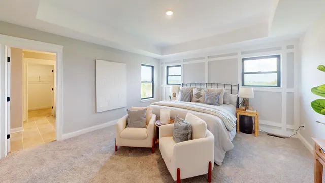 a bedroom with bed and a couch