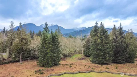 a view of a yard and mountains